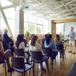 Young,Berded,Man,Speaking,On,A,Business,Training,Standing,In
